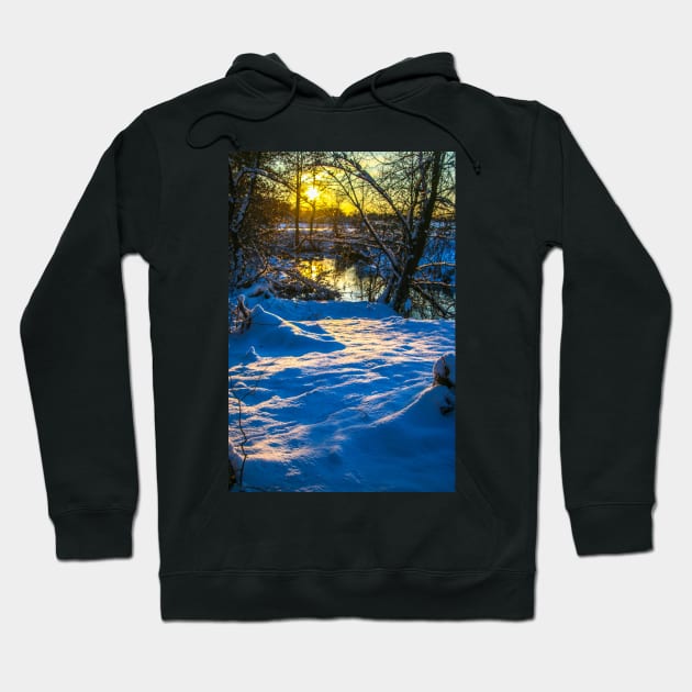 Snow falling on a river with snowy banks Hoodie by Olga Berlet